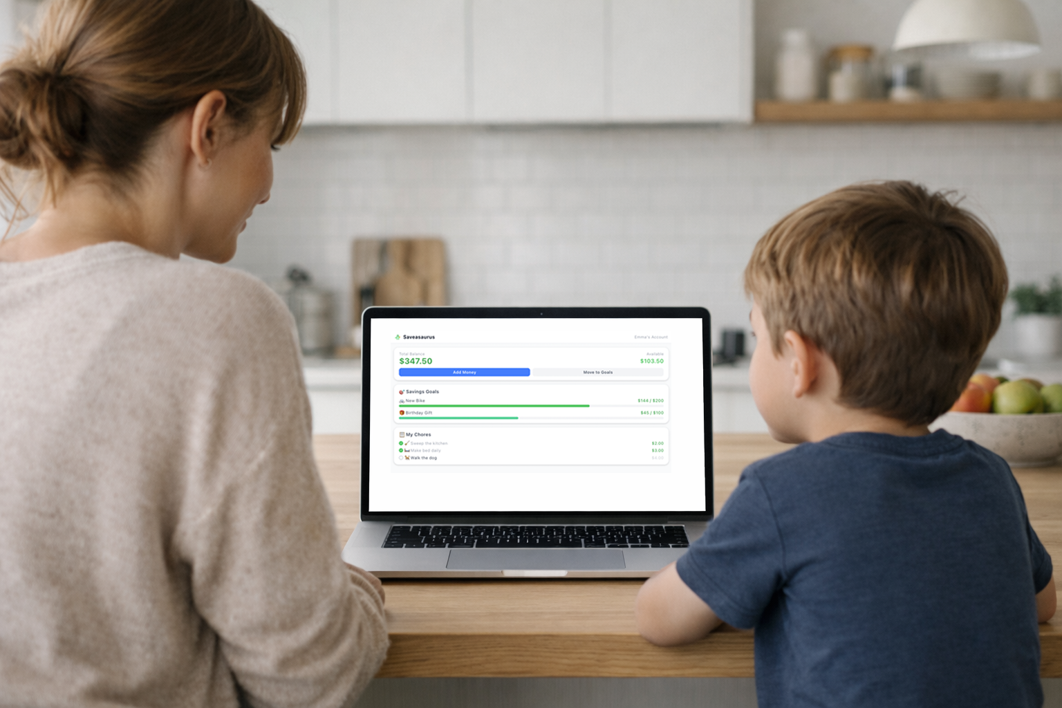 A mother and child using Saveasaurus together on a laptop